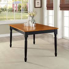 For a timeless look in the dining room, furnish the space with a black dining table. Better Homes And Gardens Autumn Lane Farmhouse Dining Table Black And Oak Walmart Com Walmart Com