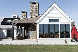 This house is what kicked off the i love the warm wood tones paired with the white siding and again black framed windows. Life Made Simple 5 Keys To Crafting Your Modern Farmhouse New England Home Magazine