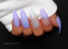 Shimmering white and silver coffin nails. White Acrylic Nails With Glitter Coffin Nail And Manicure Trends