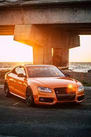 Orange Audi Coupe Parked On Gray Concrete Road Audi S5 Audi Coupe 4 Door Sports Cars