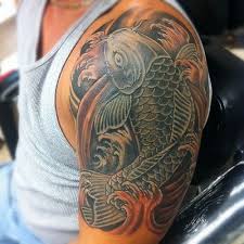 For the ladies, you can get koi tattoo designs over your hips. Amazing Black And Orange Koi Tattoo Inspiration Koi Tattoo Koi Tattoo Design Half Sleeve Tattoos For Guys