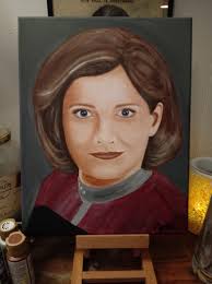 A photo of Kathryn Janeway, her husband Mark, and their dear friend, Dr.  Beverly Crusher. Thanks Q.