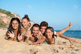 Group Of Happy Teenage Friends At The Beach Stock Photo, Picture and  Royalty Free Image. Image 84919232.