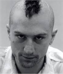 Robert De Niro's mohawk from Taxi Driver (1976) was not real because he had  to film scenes for another movie shortly after Taxi Driver. Instead, a bald  cap was created and glued