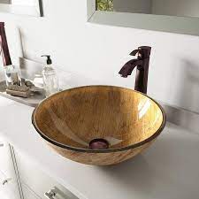 The wooden vanity countertop runs straight on as bathtub panelling and continues all the way up the wall behind the wet areas. Vigo Vessel Sink Wooden Glass Vessel Round Bathroom Sink With Faucet Drain Included 16 5 In X 16 5 In In The Bathroom Sinks Department At Lowes Com