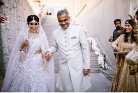 The sheer dupatta and a white blouse with golden gridlines complete the look of the outfit. Unique White Bridal Lehenga That Is Every Bride S Pick In 2019 Newstrack English 1