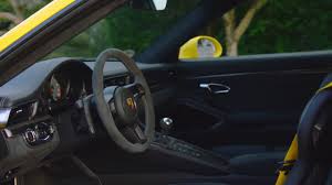 Significantly higher starting prices for the new 911 all luxury vehicle interiors offer some combination of premium materials, advanced technology, and enduring comfort. Porsche 911 Gt3 Interior Design In Yellow Trailer Automototv Youtube