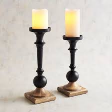 This eclectic mix of pillar holders adds height and interest to a table or mantel display. Black Wood Pillar Candle Holders Candle Holders Pillar Candle Holders Wood Pillar Candle Holders