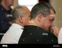 British citizen Tony Alexander King, right, listen during his trial in  Malaga, southern Spain, Monday Oct. 31, 2005, where he is being tried for  the murder of 17-year-old woman Sonia Carabantes in