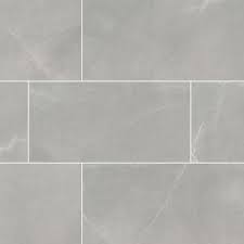 This office features a floor composed primarily of neutral tan tone tiles, bordered by a speckled gray vinyl tile perimeter, flooring; Grey Porcelain Tile Sande Series Porcelain Tile Flooring