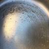 Using a soft sponge and warm, soapy water, clean the entire pan, scrubbing in a circular motion (note: 1