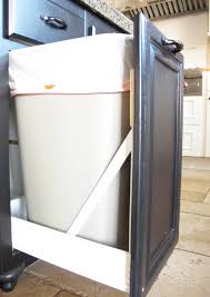 door and a drawer into a pull out trash can