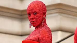 Doja Cat turns heads in red body paint and 30,000 crystals at  Schiaparelli's Paris show