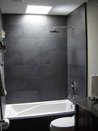 Large slate tiles suit the room's generous proportions. Small Bathroom Tiles Grey Novocom Top