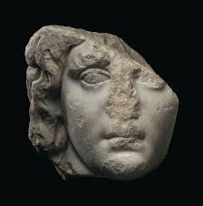 AN ATTIC RED-FIGURED KYLIX, ATTRIBUTED TO THE COLMAR PAINTER, CIRCA 500-480  B.C.