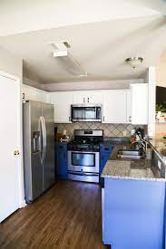 Diy painting kitchen cabinets blue. Our Diy Blue White Kitchen Cabinets Love Renovations