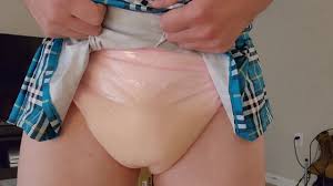 Sissy Schoolgurl in chastity pisses diaper