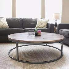 Interlocking squares come together to create a unique geometric patterned base that supports the solid wood tabletop. Round Walnut Wood And Metal Coffee Table Round Coffee Table Living Room Coffee Table Living Room Coffee Table