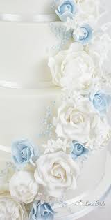Check spelling or type a new query. Cascading White And Powder Blue Roses On A White Wedding Cake Wedding Cake Roses Wedding Cake Fresh Flowers White Wedding Cakes