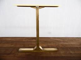 The legs are gracefully crossed for visual interest. Modern Vintage Custom Brass Table Legs 28 Besik Besik Single Bar Table Legs 24 Base Width Height 25 30 Set 2 Table Legs Metal Table Legs Brass Table Legs