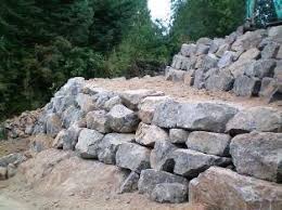 Photos of 2016 retaining wall designs show keystone interlocking blocks as the trendiest material for retaining wall construction. Retaining Walls Boulder Retaining Wall Landscaping Retaining Walls Rock Wall Landscape