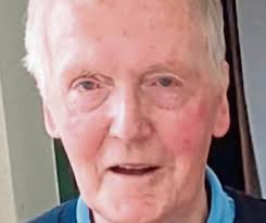 Omagh captain Ciaran Lagan, Naomh Colum Cille captains Sean Kelly and AJ  McCann, and referee John Devlin