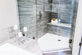 The shower is installed right in the middle of the bathroom, while on one wall sits a steel rack for the utilities while on the other are installed the shower equipments. Shower Tray Size Guide Blog Sanctuary Bathrooms