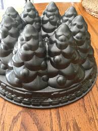 Creating a charming festive statement by dressing the table with mini trees as place settings. Nordic Ware Cast Aluminum Bundt Christmas Holiday Tree Cake Pan 1832874437