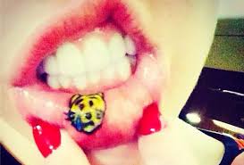 Tattoos done inside the mouth fade the quickest because they're always in contact with saliva, food, and drinks. Miley Cyrus Got An Emoji Inspired Lip Tattoo Vanity Fair
