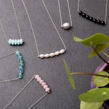 To string a pendant onto a necklace you will need an extension chain, a trigger clasp, cord tips and jump rings. How To Make A Bead Bar Necklace