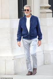 Pierce brosnan looks unrecognisable as he shaves off signature beard in lockdown the james bond star, 66, left fans stunned last week when he shared a bedraggled appearance, but he looks suaver. Pierce Brosnan Ditches The Dye Another Day And Embraces His Natural Grey Locks And Bushy Beard Daily Mail Online