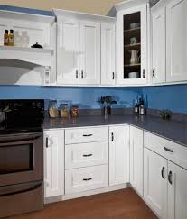 dark blue walls with white cabinets
