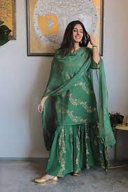 Star shaped ornamental motifs are scattered all over the shirt. Cotton Green Sharara Set Simple Pakistani Dresses Designer Dresses Indian Traditional Indian Outfits