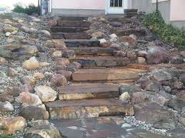 Landscaping A Slope Steps made with flagstone are durable and natural looking. landscaping a slope