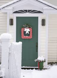 Frame the winter door decoration with sprigs of evergreen to enhance the seasonal display. 52 Christmas Door Decorating Ideas Best Decorations For Your Front Door