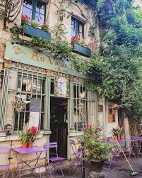12 Of The Cutest Cafes In Paris The Most Instagrammable Parisian Cafes Heather Rinder Parisian Cafe Paris Cafe Cute Cafe
