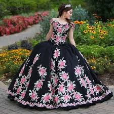 Hem hits about at the knee. New Style Black Quinceanera Dresses 2021 V Neck Off Shoulder Embroidery Flower Applique Long Sweet 15 16 Birthday Party Gown Quinceanera Dresses Aliexpress