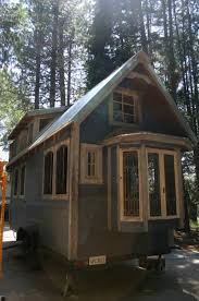 The exterior steals the eye with flourishes such as window ornamentation, cornices, finials, wraparound porches, bright colors and often the presence of a corner turret. You Ll Fall In Love With This Victorian Inspired Tiny House By Molecule Tiny Homes Tiny Houses