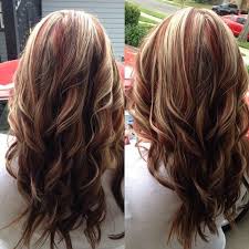 This dark hair color looks particularly elegant and immediately gives the wearer sensuality. Blonde Hair With Red Highlights Like This One Brown Blonde Hair Hair Styles Red Blonde Hair