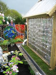 Garden Ideas From Recycled Materials Greenhouse Made From Recycled Plastic Bottles And A Mural Made From Recycled Planters Home Garden Design Garden Design