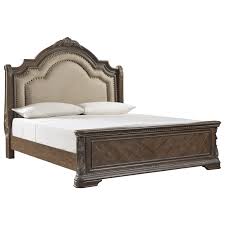 Elegance can be bold, this bedroom collection boats a truly distinctive look that is filled with character and chic appeal. Signature Design By Ashley Charmond Traditional California King Upholstered Bed With Nailhead Trim Framing Royal Furniture Upholstered Beds