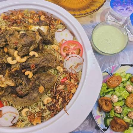 Khuzi” (Ouzi/Ghuzi) is the national dish of the UAE. It is a dish of slow  roast lamb presented with nuts, veggies , and raisins on top of a bed of  spicy rice.