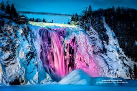 Montmorency falls , french chute montmorency , waterfall at the mouth of the montmorency river in québec region, southern quebec province, canada , about 7 miles (11 km) northeast of quebec city. Illumination Glacee Sous La Chute Montmorency Martin Labbe