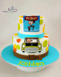 Mr Bean Cake He S Funny And Quirky And This Time Mr Bean Appears On This Two Tiered Cake For A Special Young Man S Bi Mr Bean Cake Bean Cakes Mr Bean