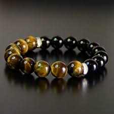 The meaning of blue tiger's eye tigers eye is a protective stone that traditionally warded off curses and ill wishes. Amazon Com Tiger Eye Black Obsidian Onyx Protection Bead Bracelet Chakra Energy Gift For Men And Women 10mm 8mm Handmade