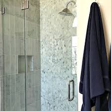She recommends preventing soap scum from building up by using a squeegee on shower walls after each and every shower. Safely Clean A Shower Glass Door With Marble Tile Abbotts At Home