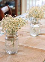 Baby S Breath In Mason Jars As Centerpiece Decorations For Rustic Cowgirl First Birthday Part Rustic Birthday Parties Floral Birthday Party Boho Birthday Party