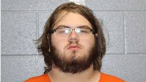 Adrian man arrested, charged with murdering his adoptive father