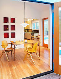 Wood table with dark concrete texture background. How To Create A Sensational Dining Room With Red Panache
