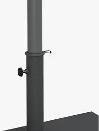 A classic patio umbrella has a central pole that can be secured through the centre of an appropriate garden table and/or attached to a weighted base. John Lewis Partners Half Round Freestanding Parasol Flat Base Weight 21kg At John Lewis Partners